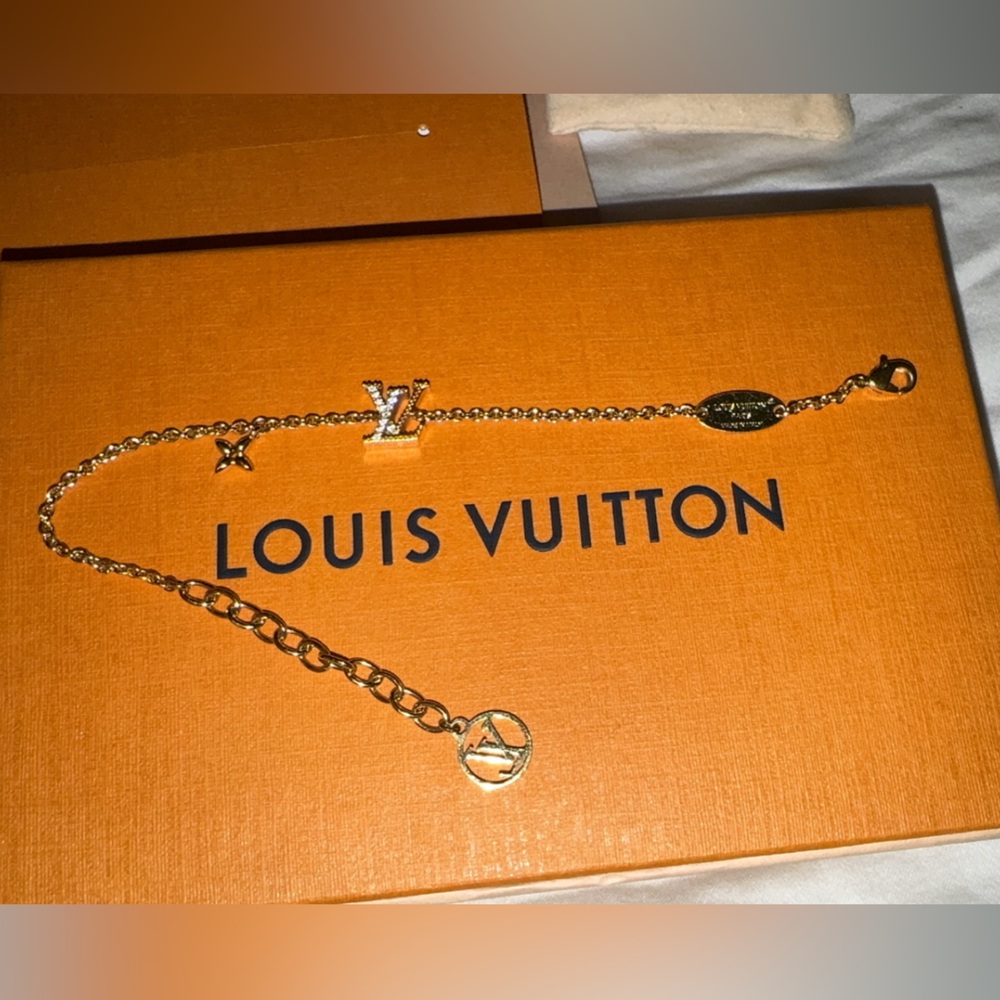 Louis Vuitton Gold-tone LV Charm Bracelet on Orange Box